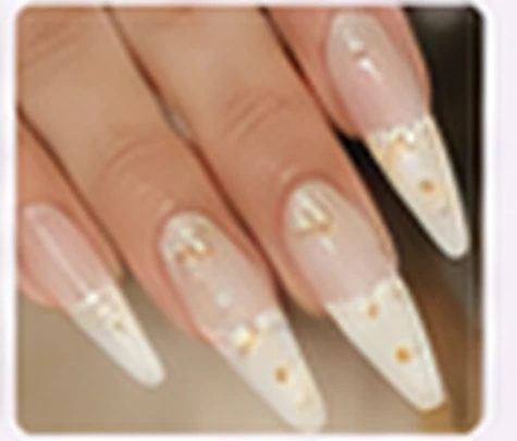 Nude acrylic nails with delicate gold accents